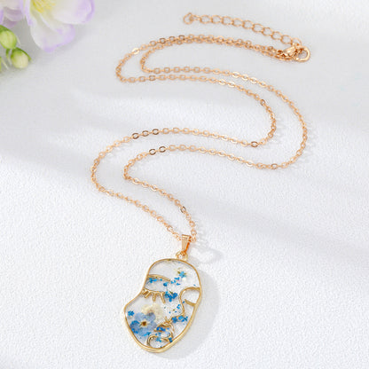Abstract Face Forget Me Not Flower Necklace