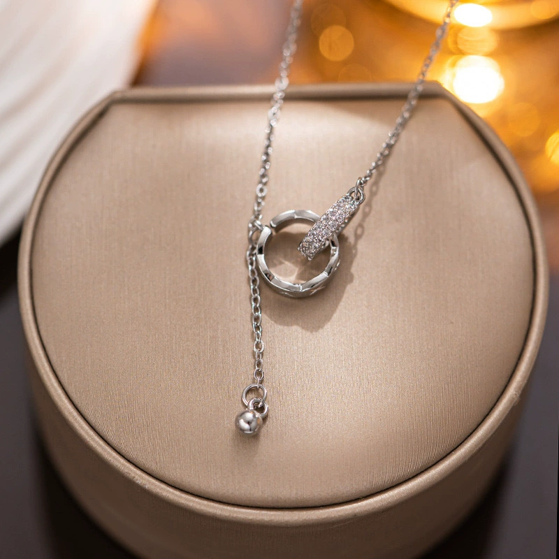 “Linked in Time” – Interlocked Double Ring Tassel Necklace