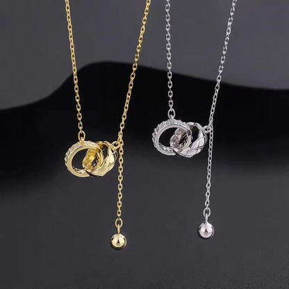 “Linked in Time” – Interlocked Double Ring Tassel Necklace