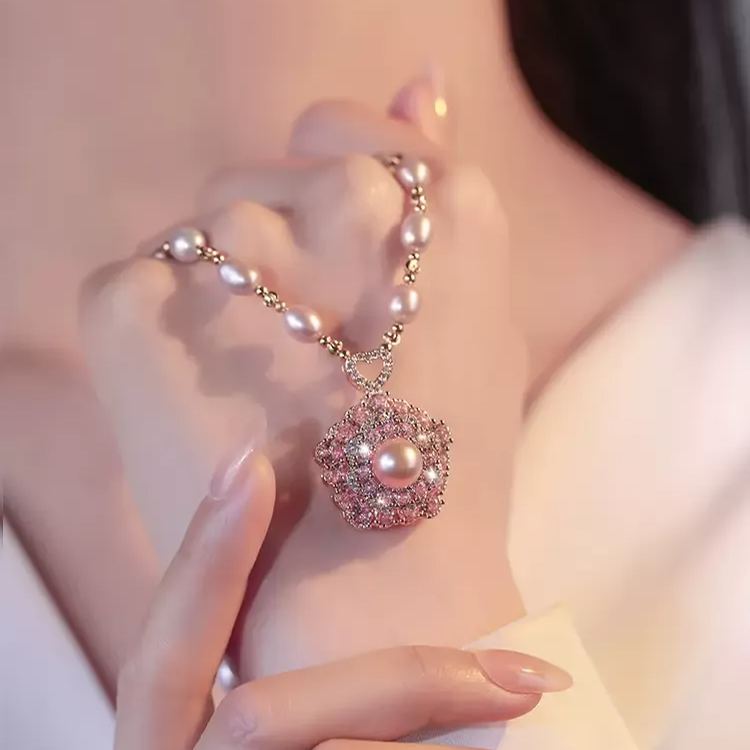 - Pink Rotating Pearl Lucky Flower Necklace